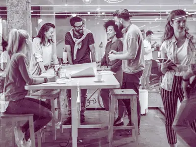 casual colleagues socialising in a modern office