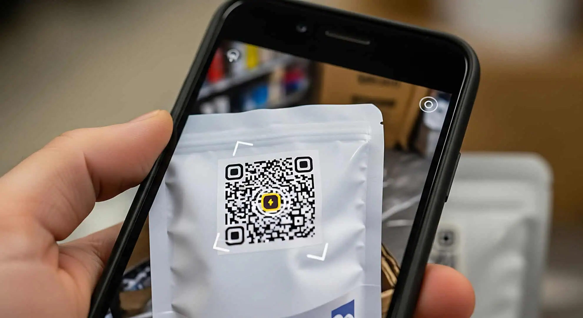 Using smartphone to scan QR code on product flexible packaging for information or discounts enhancing customer experience and engagement
